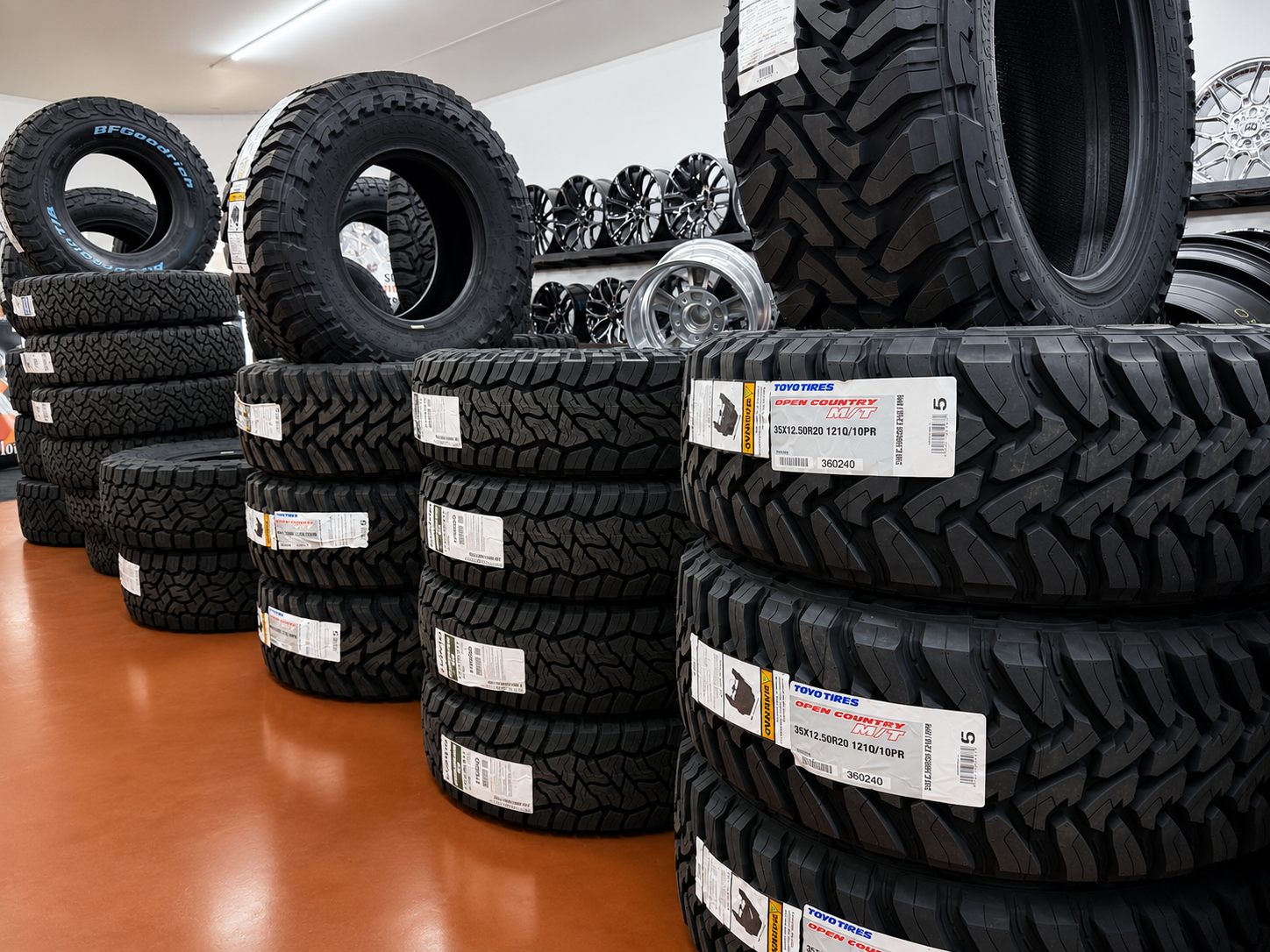 Toyo and BFGoodrich off-road tires stacked in the Rocket Tires showroom